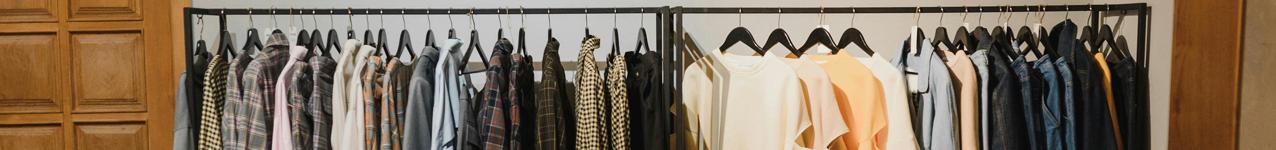 services page header. clean clothes on a rack